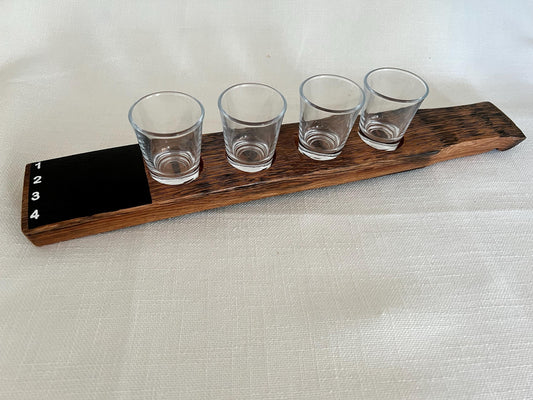 Oak wood shot flight board with four slots and a chalkboard.